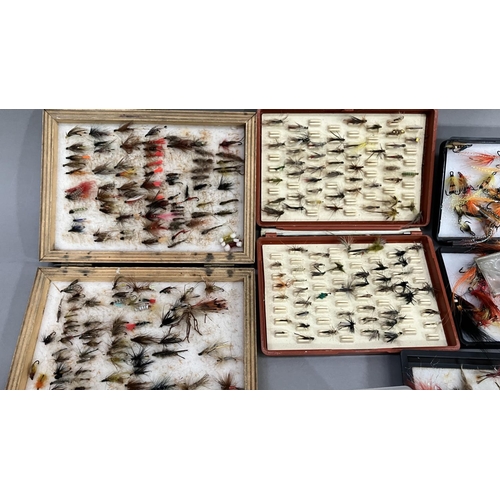 264 - Seven boxes of flies, various and a fishing fly brooch