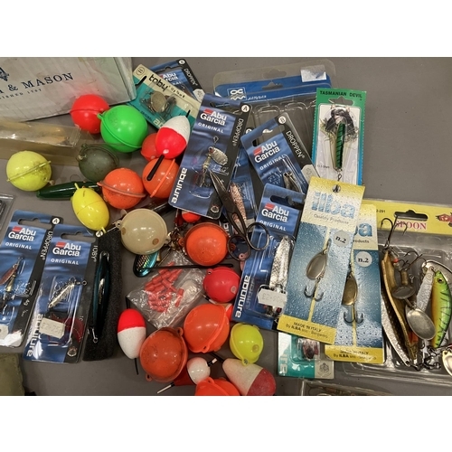 259 - Fishing: a quantity of fishing line and weights floats, salmon and sea spinners, assorted floats hea... 