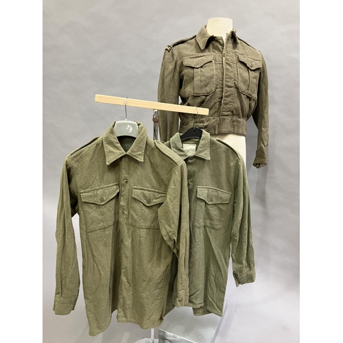 11 - A British Army 1951 battle dress with REME insignia together with two later wool army shirts