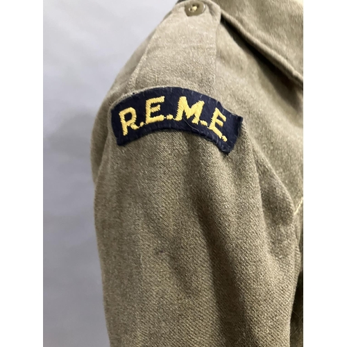 11 - A British Army 1951 battle dress with REME insignia together with two later wool army shirts