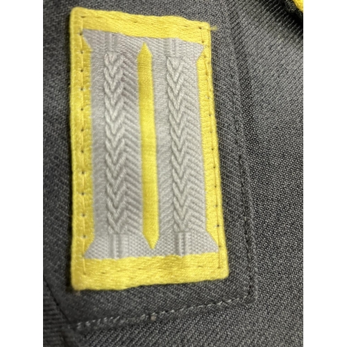 21 - Three West German Luftwaffe dark blue tunics and two army tunics, post war (5)