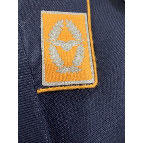 21 - Three West German Luftwaffe dark blue tunics and two army tunics, post war (5)