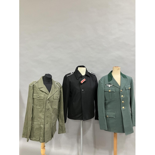 23 - A German post war jacket with a reproduction WWII Wermachtsadler eagle, together with a black field ... 