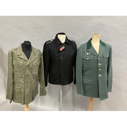 23 - A German post war jacket with a reproduction WWII Wermachtsadler eagle, together with a black field ... 