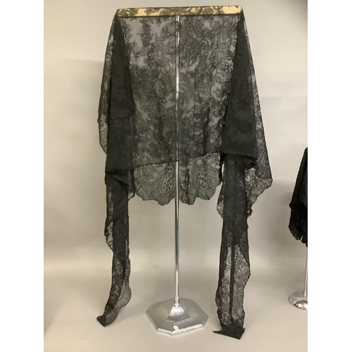 268 - Victorian lace, black: consisting of a fine handmade triangular shawl, floral design; a second trian... 