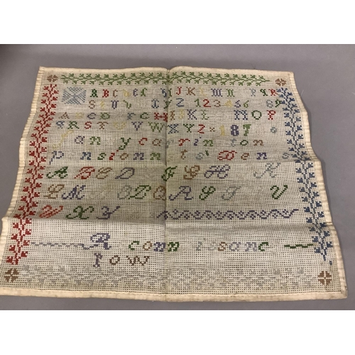 212 - An antique linen band sampler, alpha/numeric, dated 1834; together with a colourful alpha/numeric sa... 