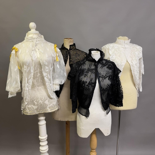 318 - Edwardian style blouses: four blouses, two black, two cream, all with high necks, different styles o... 