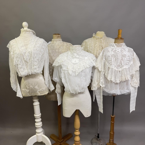 320 - Two Edwardian blouses, the first white, high-necked, full sleeves, incorporating floral machine lace... 