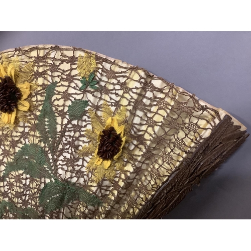 71 - Ann Collier: Sunflowers, a large lace fan mounted on late 19th century carved and pierced wood stick... 