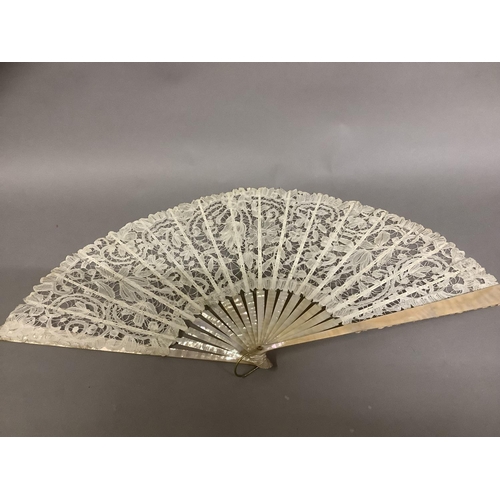 53 - Antique Lace: a c 1890’s Mixed Brussels lace fan, the monture of pink mother of pearl, the deep leaf... 