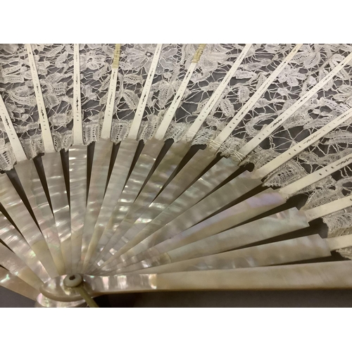 53 - Antique Lace: a c 1890’s Mixed Brussels lace fan, the monture of pink mother of pearl, the deep leaf... 