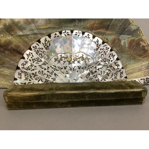 13 - C 1860/70’s, a good mother of pearl fan with extensive gilding, deep gorge and well carved sticks, t... 