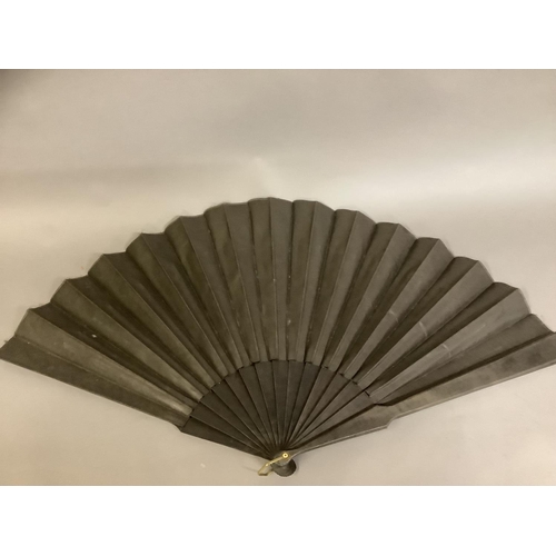 26 - A varied selection of 19th and 20th century fans, comprising a very large example with black wood mo... 