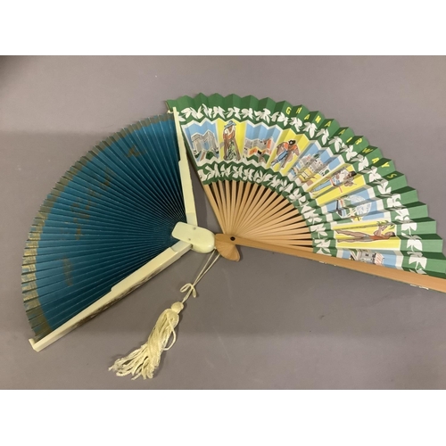 116 - Airline and travel fans: a folding paper fan advertising Ghana Airways, the double paper leaf in gre... 