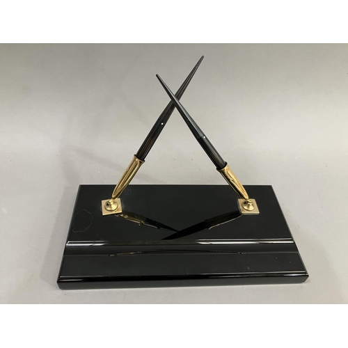 93 - A Sheaffer's black and gilt metal desk standish with two fountain pens, each fitted with a 14K gold ... 