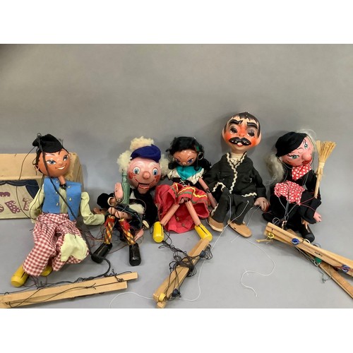 75 - A Pelham Puppet 'Dutch Boy', in original box together four others, unboxed, including Mexican Gunsli... 