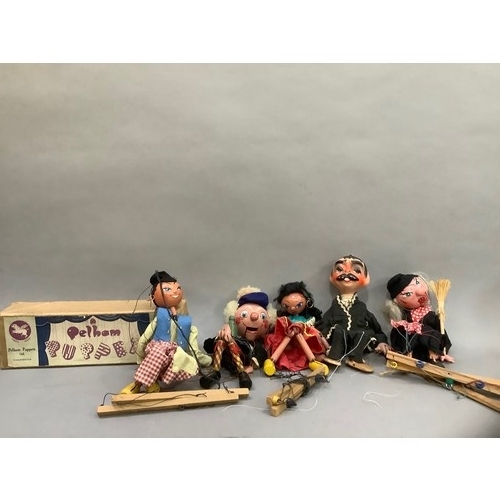 75 - A Pelham Puppet 'Dutch Boy', in original box together four others, unboxed, including Mexican Gunsli... 