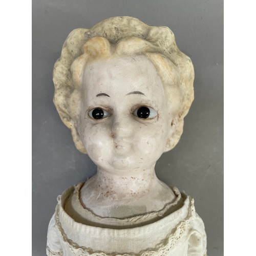 119B - A 19th century wax headed doll with moulded hair and glass eyes, soft body and wooden limbs, approxi... 