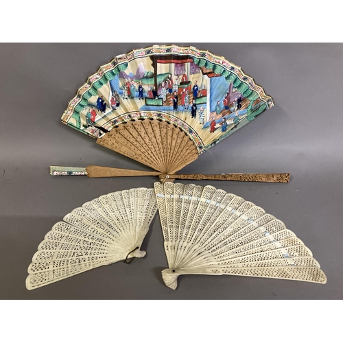 132 - A Chinese Qing Dynasty asymmetrical carved wood Mandarin fan, 19th century, the leaf with robed figu... 