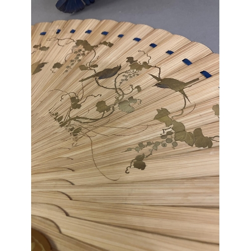 133 - Oriental fans: A detailed Chinese folding fan with double paper leaf, each side showing a topographi... 