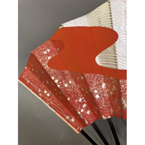 133 - Oriental fans: A detailed Chinese folding fan with double paper leaf, each side showing a topographi... 