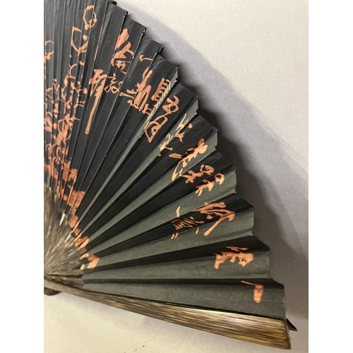 134 - An original fan by Chinese Master Artist Fu Hua, 20th century, the recto painted with flowering bush... 