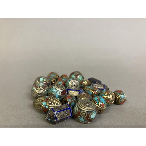 188 - Trade beads: a selection of small beads with metal inlay, four similar in royal blue, the remainder ... 