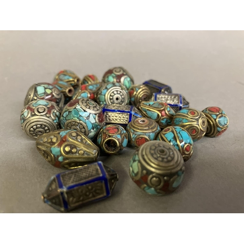 188 - Trade beads: a selection of small beads with metal inlay, four similar in royal blue, the remainder ... 