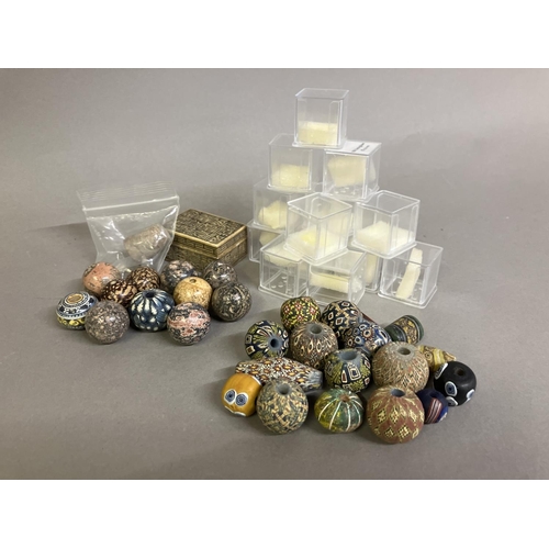 195 - Trade beads:  a selection of mainly round beads, some matt, some shiny, all with intricate patterns,... 