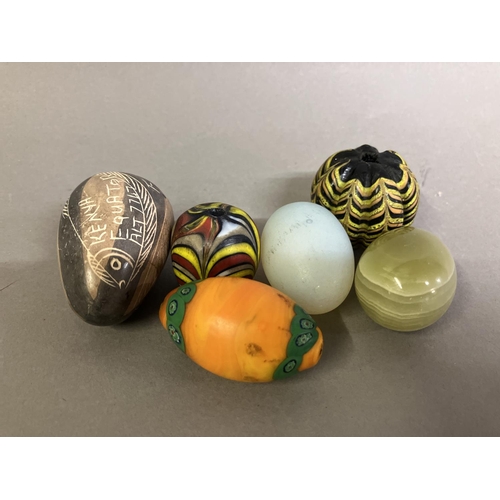 203 - Trade beads: A selection of unusual beads and mineral eggs, comprising a very large black and yellow... 