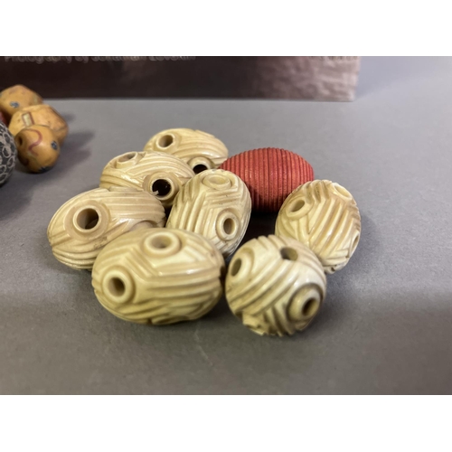 204 - Trade beads:  a good selection of beads, various sizes and shapes, many black or grey, carved, other... 