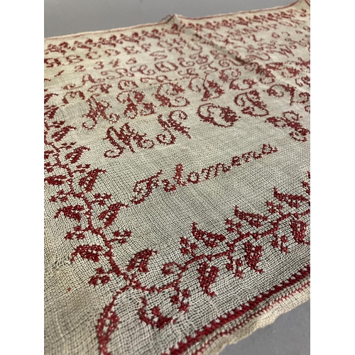 209 - An Antique European sampler dated 1908, alpha-numeric, worked in red on a fairly open weave canvas, ... 