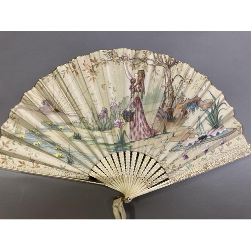 37 - An Art Nouveau fan, the monture of bone, shaped and gilded, the silk leaf painted with a lady in a s... 