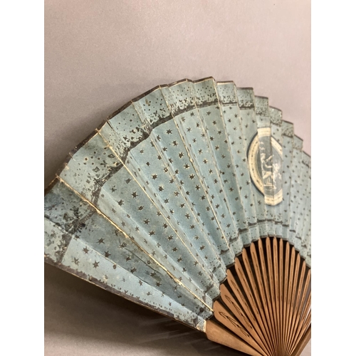 4 - Two late 18th century wood fans, the first a brisé with rounded tips, pierced, with applied cartouch... 