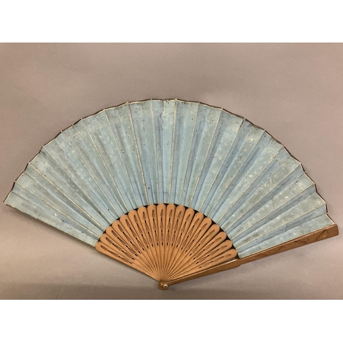 4 - Two late 18th century wood fans, the first a brisé with rounded tips, pierced, with applied cartouch... 