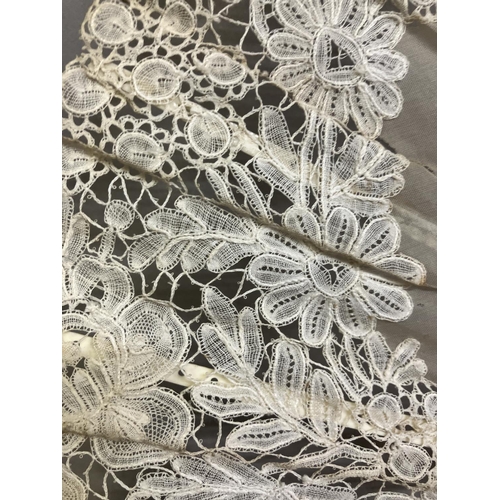 49 - A good Brussels lace fan, mounted on mother of pearl, burgau, including the ribs, the leaf most like... 