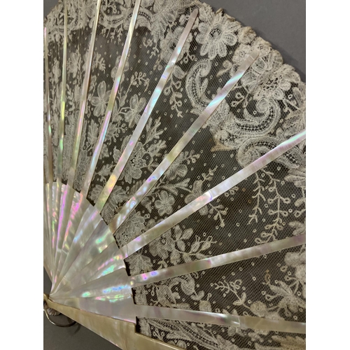 49 - A good Brussels lace fan, mounted on mother of pearl, burgau, including the ribs, the leaf most like... 