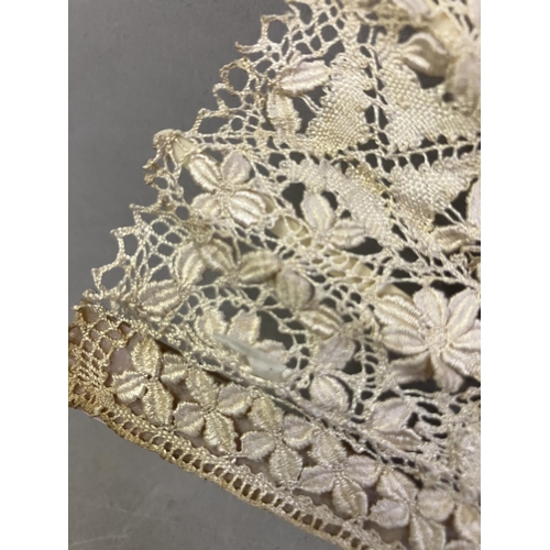 50 - Antique Lace: an early 20th century Maltese silk lace fan, the leaf mounted on pink mother of pearl ... 