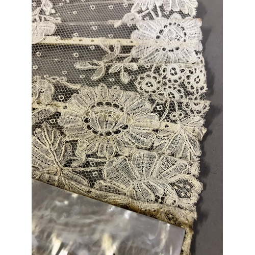 54 - Antique Lace :A large Mixed Brussels and white mother of Pearl fan, c 1890’s, the lace leaf with a c... 