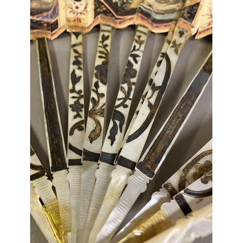 6 - A late 18th century Grand Tour fan, the monture of mother of pearl, gilded, with design to the gorge... 