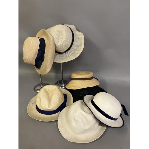 299 - Early 20th century straw hats, French, unused, still labelled, various colours, mostly with ribbon, ... 