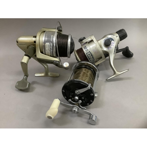 186 - Three Saltwater fishing reels to include Quantum Blue Runner, Stinger ZL50 and one other unnamed (3)