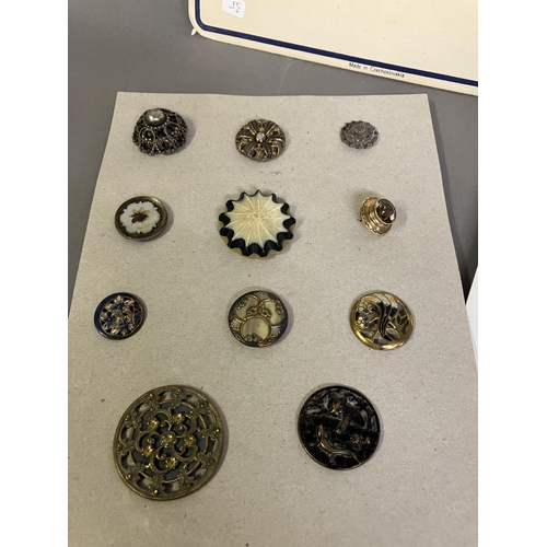 248 - Fine buttons and buckles, some on original Trade sample cards: two cards displaying mother of pearl ... 