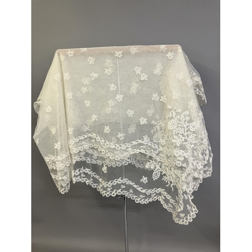 275 - Antique Lace: a late 19th century Honiton lace veil, bobbin appliqué on machine net, with a scallope... 