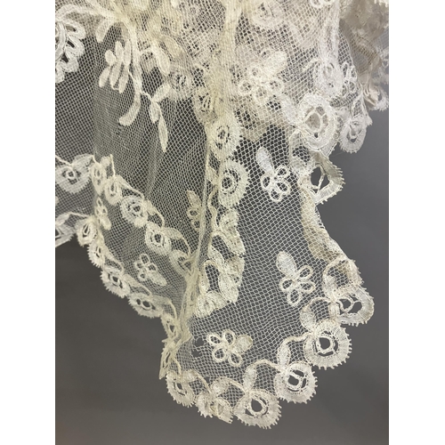 275 - Antique Lace: a late 19th century Honiton lace veil, bobbin appliqué on machine net, with a scallope... 