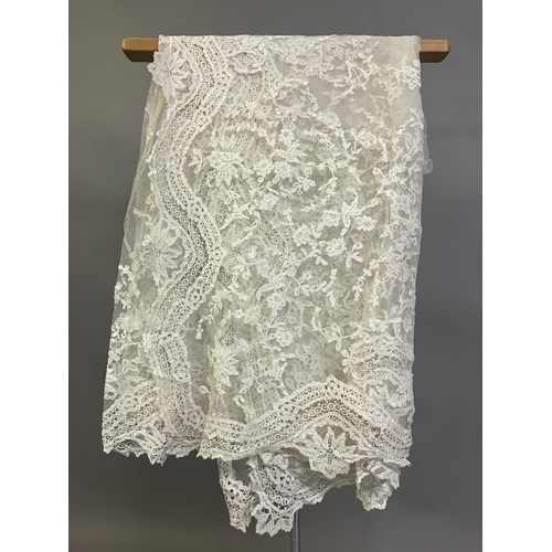 279 - Antique Lace: an elaborate late 19th century Honiton lace wedding veil, the net densely applied with... 