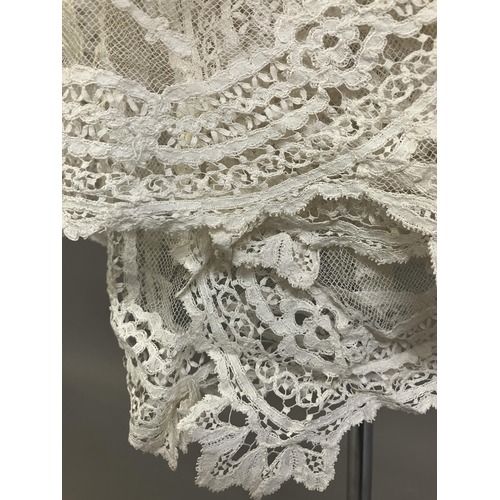 279 - Antique Lace: an elaborate late 19th century Honiton lace wedding veil, the net densely applied with... 