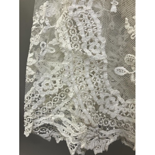 279 - Antique Lace: an elaborate late 19th century Honiton lace wedding veil, the net densely applied with... 