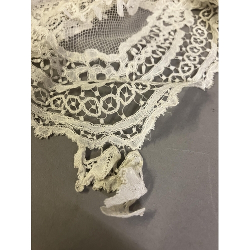 279 - Antique Lace: an elaborate late 19th century Honiton lace wedding veil, the net densely applied with... 