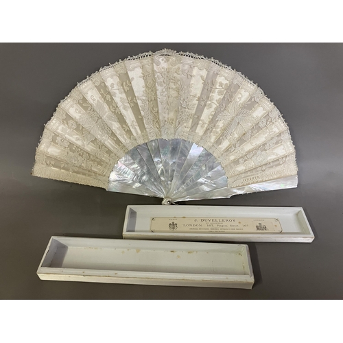 51 - A 19th century Brussels Bobbin Appliqué lace fan, the monture of white mother of pearl, the head sha... 